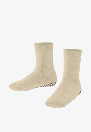 Beige Baumwollsocken mit gerippten Bündchen und strukturierten Sohlen, die kleine schwarze Grip-Punkte für verbesserten Halt aufweisen.