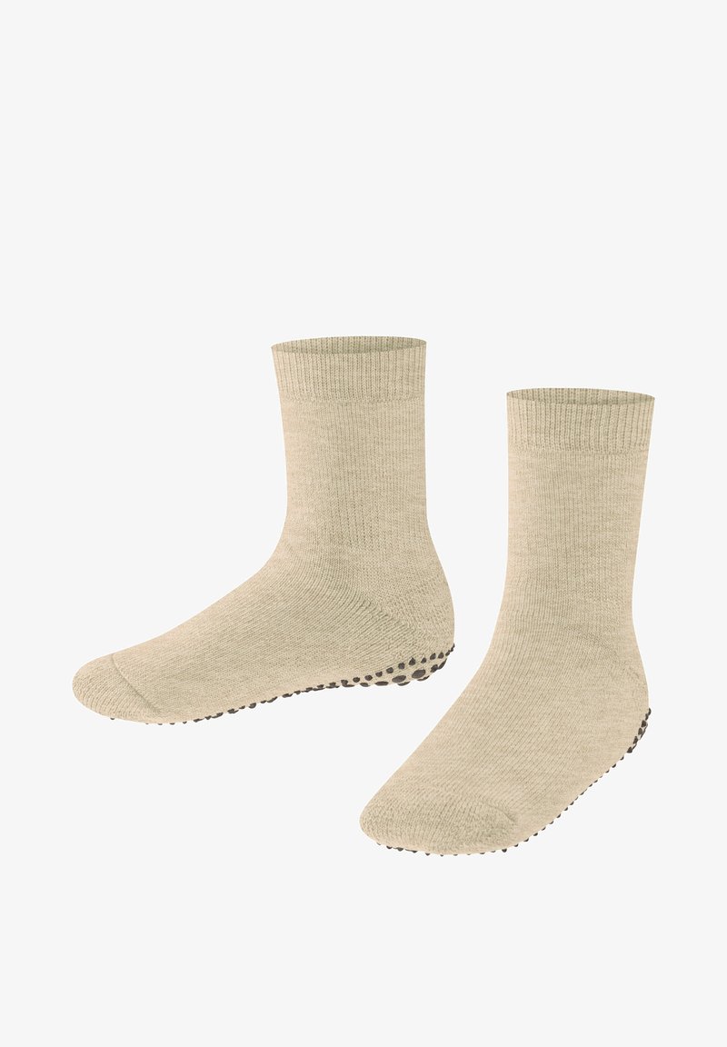 Beige Baumwollsocken mit gerippten Bündchen und strukturierten Sohlen, die kleine schwarze Grip-Punkte für verbesserten Halt aufweisen.