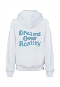 White hoodie made of soft fabric, featuring a large light blue graphic text on the back that reads "Dreams Over Reality."