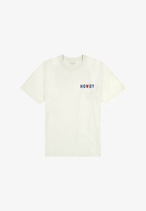 T-shirt en coton crème clair avec l'inscription "HOWDY" en lettres bleues et rouges sur la poitrine gauche. Encolure ronde classique et manches courtes.
