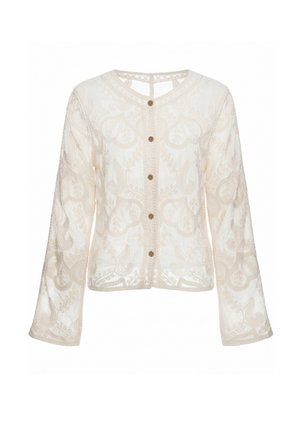 Langærmet, cremefarvet, gennemsigtig bluse med broderede blomsterdekorationer og fem brune knapper foran.