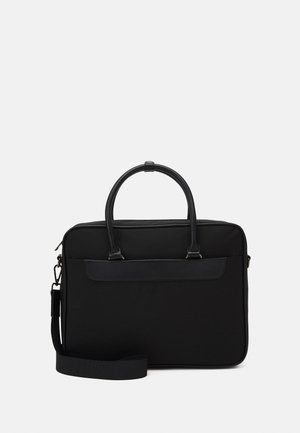 Sacoche d'ordinateur portable noire en tissu durable avec des accents en cuir lisse, poignées doubles et une bandoulière réglable. Forme rectangulaire.