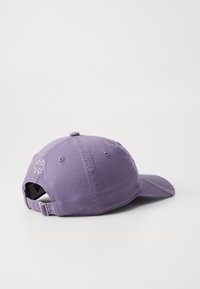 Purple cotton baseball cap with a curved brim, embroidered logo on the back, and an adjustable strap closure. Soft texture and casual design.