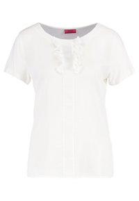 Blusa bianca a maniche corte con scollatura tonda, caratterizzata da un dettaglio di volant verticale sulla parte anteriore e una trama di tessuto liscia.
