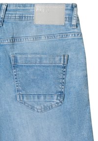 Light blue denim jeans with a single back pocket and a light gray label stitched at the waistband reading "WHEREVER YOU GO CECIL."