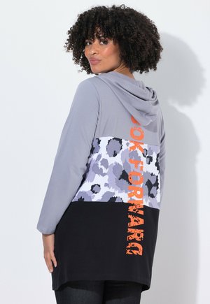 Hooded sweatshirt with grey long sleeves, leopard print lower panel in purple and black, and bright orange "FORWARD" text. Soft fabric.