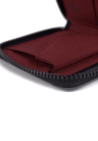 Black zippered wallet with interior burgundy fabric compartments, smooth texture, and a structured design for organizing cards and cash.