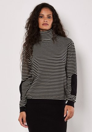 Zwart en crèmekleurig gestreept coltricot trui met lange mouwen, voorzien van effen zwarte elleboogpatches en een ribbelrand. Zachte stoftextuur.