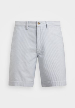 Pantaloni corti a righe in azzurro chiaro e bianco. Realizzati in cotone, con chiusura a bottoni, tasche laterali e orlo dritto.