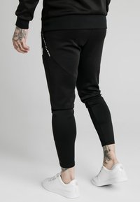 SIKSILK Teplákové kalhoty - black