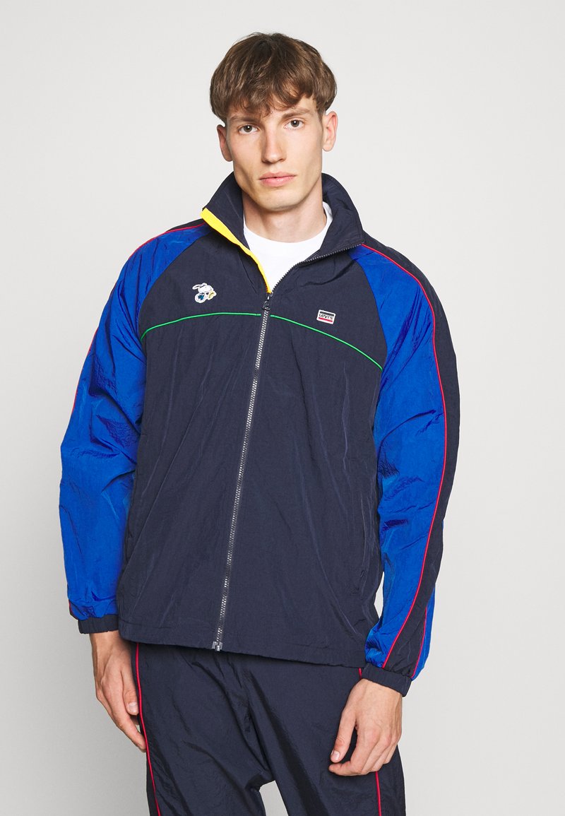 Levi's® LEVI'S® X PEANUTS MILES TRACK JACKET UNISEX Jakna za