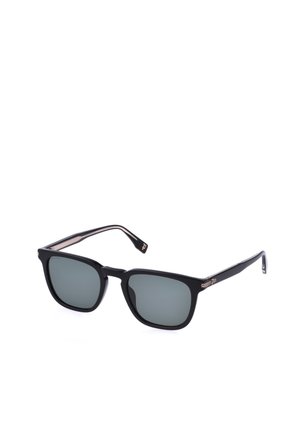 Lunettes de soleil rectangulaires noires avec des verres teintés foncés et des détails dorés sur les branches, présentées sur fond blanc.