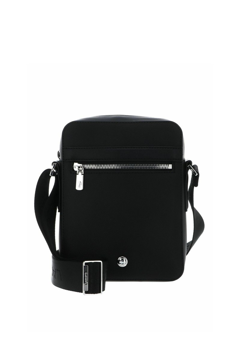 Black crossbody bag made of textured material, featuring a front zip pocket, adjustable strap, and a logo accent on the front.
