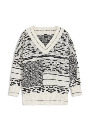 Musta-valkoinen kuvioitu neulepaita, jossa on V-aukko ja resorit hihansuissa, kauluksessa ja helmassa, aseteltuna tasaiselle valkoiselle pohjalle.