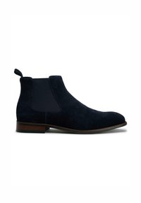 Navy suede Chelsea boot with elastic side panels, rounded toe, and a low stacked heel for stability. Features a pull tab for easy wear.