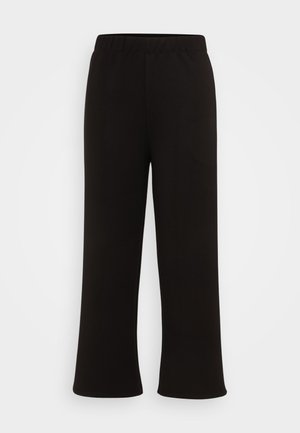 Schwarze, weite Hose mit elastischem Bund, aus weichem, dehnbarem Stoff. Die Ärmel enden mit einem leichten Schlag und bieten eine lässige Passform.