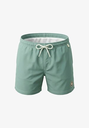 Short de bain vert clair avec cordon blanc, doublure intérieure en mesh et petit patch rond avec logo en bas de la jambe gauche.