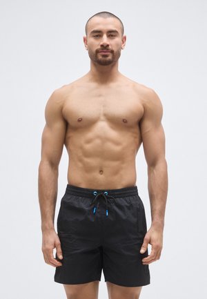 MENS BEACH SOLID - Plavecké šortky  - black
