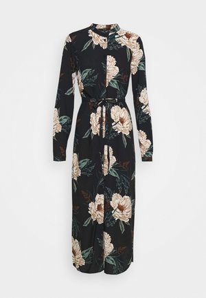 Robe midi noire à manches longues boutonnée, imprimé floral beige et vert et ceinture nouée à la taille.