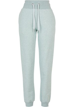 Pantaloni jogger verde menta chiaro realizzati in tessuto morbido. Presentano una vita a coste con coulisse e polsini elastici alle caviglie.
