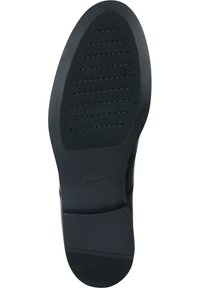 Semelle en caoutchouc noir avec surface texturée, présentant des rainures horizontales et de petits trous pour la respirabilité. La marque sur le côté indique "GEOX ITALIAN PATENT."