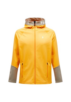 Gul sportsjakke med lynlås fortil, grå ærmer og høj krave med "PEACE" i hvid. To sidelommer og en glat tekstur.