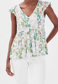 Floral peplum top with a V-neck, featuring a white background and colorful botanical patterns, short ruffled sleeves, and a loose fit.