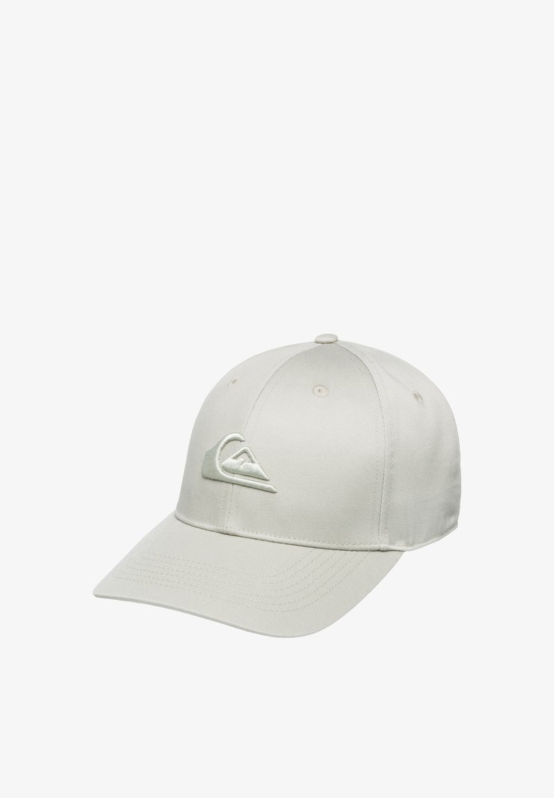 Gorra de béisbol color beige claro hecha de tela, con una visera curva y un logotipo bordado en un color pálido a juego en la parte frontal.