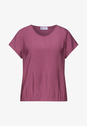 Lyhythihainen naisten liila pusero pyöreällä pääntiellä ja kevyesti kerätyllä helmalla, valmistettu kevyestä kankaasta.