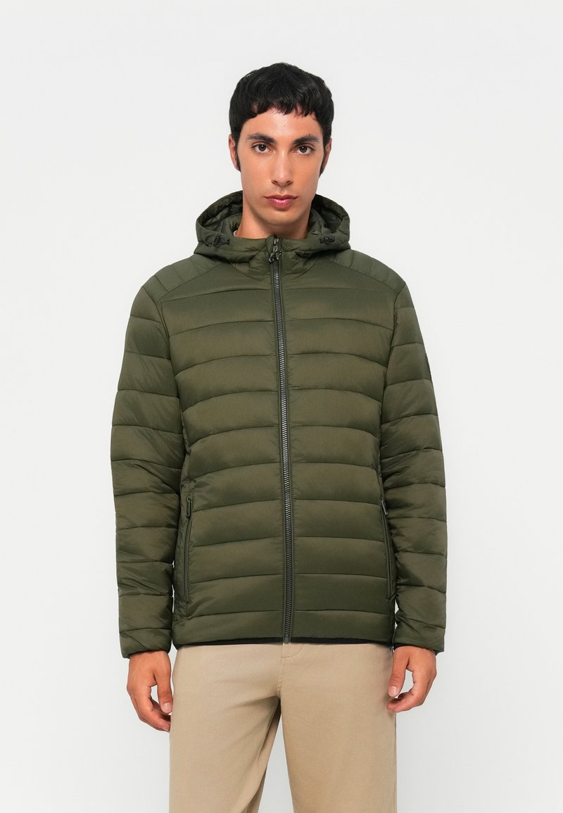 Olive green puffer jacket with a hood, quilted texture, full-length zipper, and two side pockets; smooth, lightweight material.