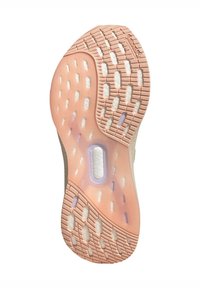 Sula på en sneakers med en texturerad gummiyta i persika och vitt, med dämpande kuddar och en genomskinlig mittdel som rymmer teknologimärkning.
