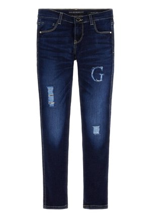 Donkere blauwe skinny jeans met versleten accenten, waaronder een rafelige "G" op de rechterdij, voorzakken en een tailleband met knoopsluiting.