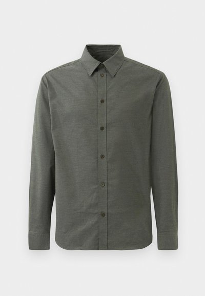 Tume rohelise värvi pikkade varrukatega särk, valmistatud tekstureeritud riidest. Omab klassikalist kraed ja viit esistupid.