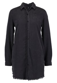 Camicia nera a maniche lunghe con bottone frontale, colletto e orlo sfrangiato. Realizzata in un tessuto morbido e testurizzato con una vestibilità comoda.