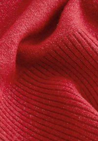 Red knitted fabric with a ribbed texture, featuring a slightly fuzzy surface and a rich, even color. No visible patterns or accents.