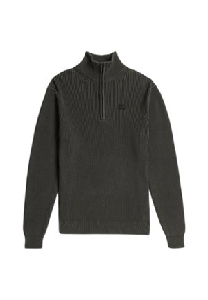 Maglione lavorato a maglia verde scuro con collo alto e mezza cerniera. Presenta una texture a coste e una piccola toppa con il logo sul petto.