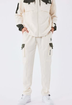 TECHNIQUE - Cargohose - crème camel   olive