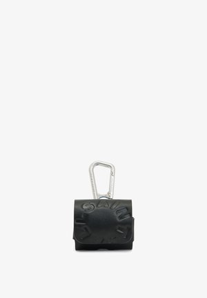 Black leather pouch with embossed "SAINT" text, featuring a silver carabiner clip for attachment. Smooth texture, compact rectangular shape.