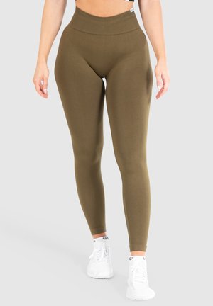 Hoge taille, olijfgroene leggings gemaakt van rekbaar materiaal, met een gladde textuur en een figuurvormend ontwerp. Geaccentueerd met een subtiel logo.