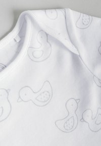 White cotton baby onesie featuring a light gray print of duck silhouettes, with soft texture and ribbed neckline for comfort.