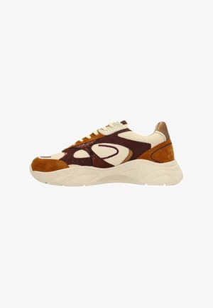 Multicolored sneaker with a cream mesh upper, brown suede accents, and a textured maroon overlay. Chunky white sole with curved patterns.