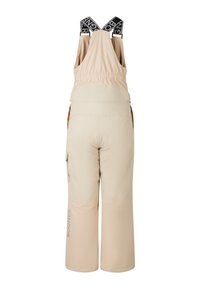 Krémově béžové zateplené lyžařské kalhoty s černými elastickými ramenními popruhy, bočními kapsami a značením na dolní části nohou a na popruzích.