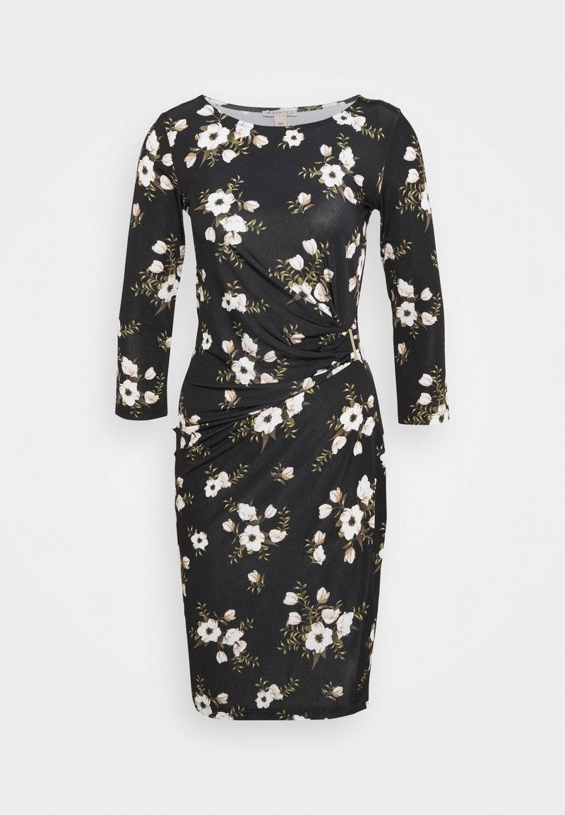 Robe noire à fleurs avec manches trois-quarts, présentant un détail torsadé à la taille. Fabriquée en tissu doux, ornée de fleurs blanches et beiges.