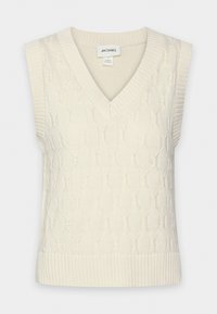 Cremfarbener ärmelloser Pullover mit V-Ausschnitt, der ein strukturiertes Rautenmuster und gerippte Kanten aufweist. Mit dem Markenlabel "MONKL" versehen.