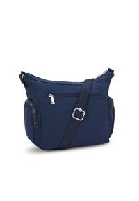 Borsa a tracolla blu navy realizzata in tessuto resistente, con scomparto principale con zip, tasca frontale e tracolla regolabile per una maggiore comodità.