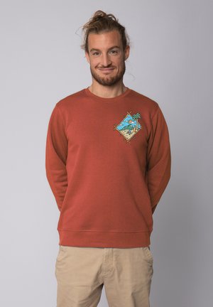 Roestkleurige sweatshirt van katoen met lange mouwen en een ronde hals. Heeft een kleurrijke palmboom en landschap graphic op de linkerborst.