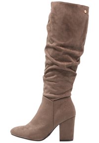 Brown suede knee-high boots with a slouchy design, pointed toe, and chunky heel. Features a small accent button near the top.