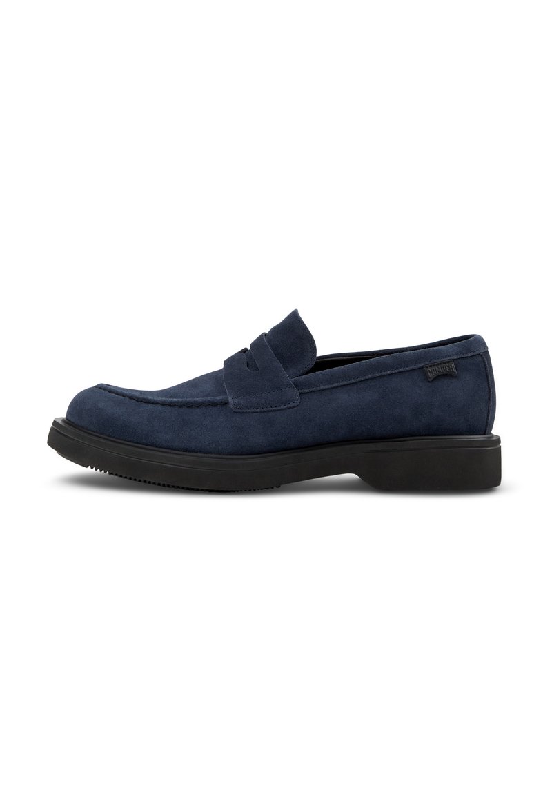 Navy blue suede loafers with a simple design, featuring a smooth texture, round toe, and a low black rubber sole.