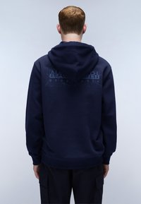 Marineblauwe hoodie met een gestructureerd National Geographic-logo op de achterkant. Voorzien van een trekkoord capuchon en geribde manchetten en zoom.