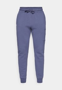 CENTRE TAPERED POCKET PANTS - Tracksuit bottoms - nightshadow blue